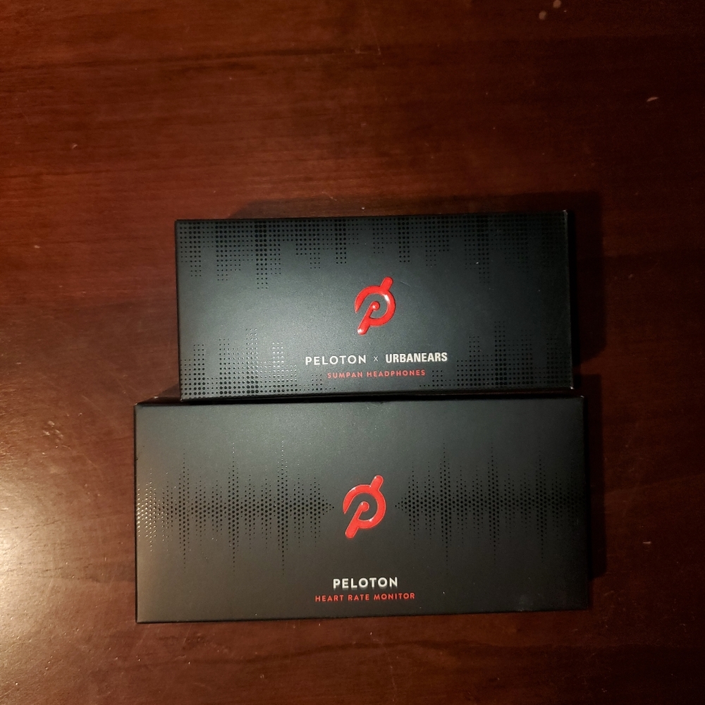 Brand new Peloton ear buds and heart rate monitor